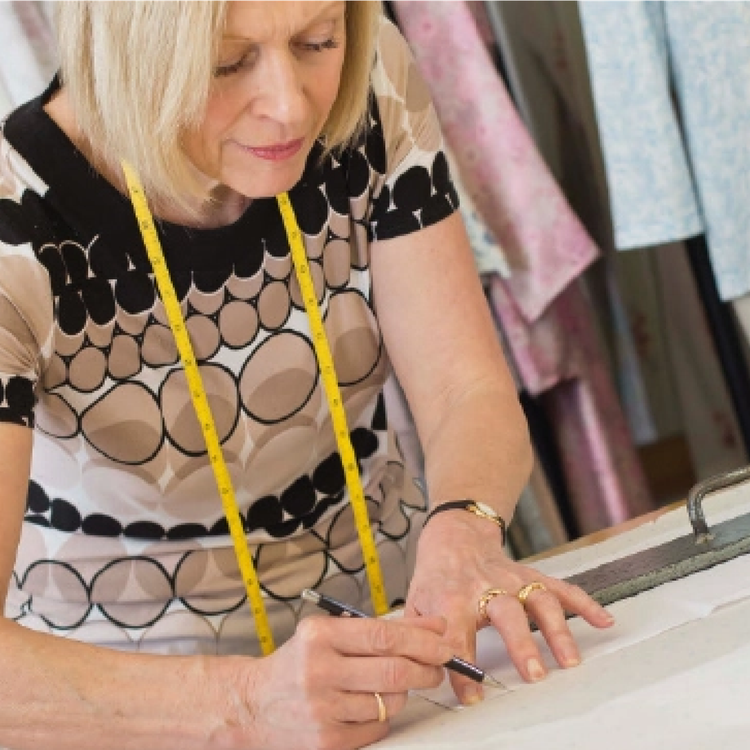 A David Nieper seamstress making a garment in the Derbyshire workrooms